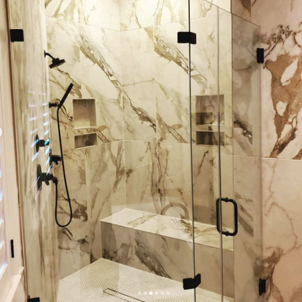 A Footprints Floors Raleigh marble tile shower installation.