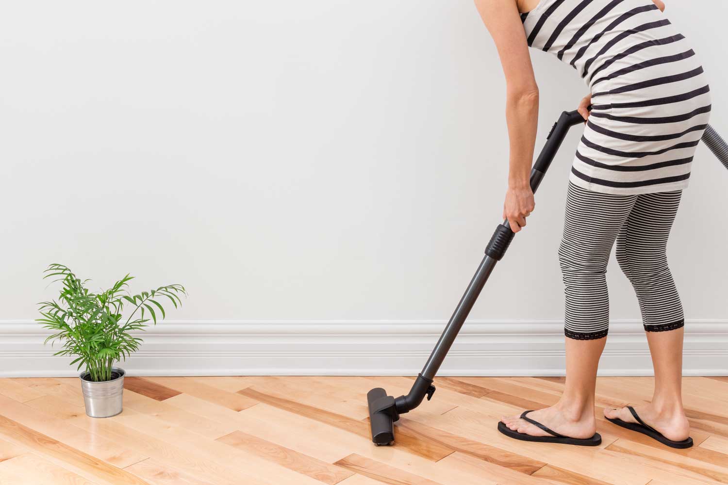 Regulary vacuum or sweep floors to remove dirt and keep your home floors looking amazing - tips from Footprints Floors in Chandler / Gilbert.
