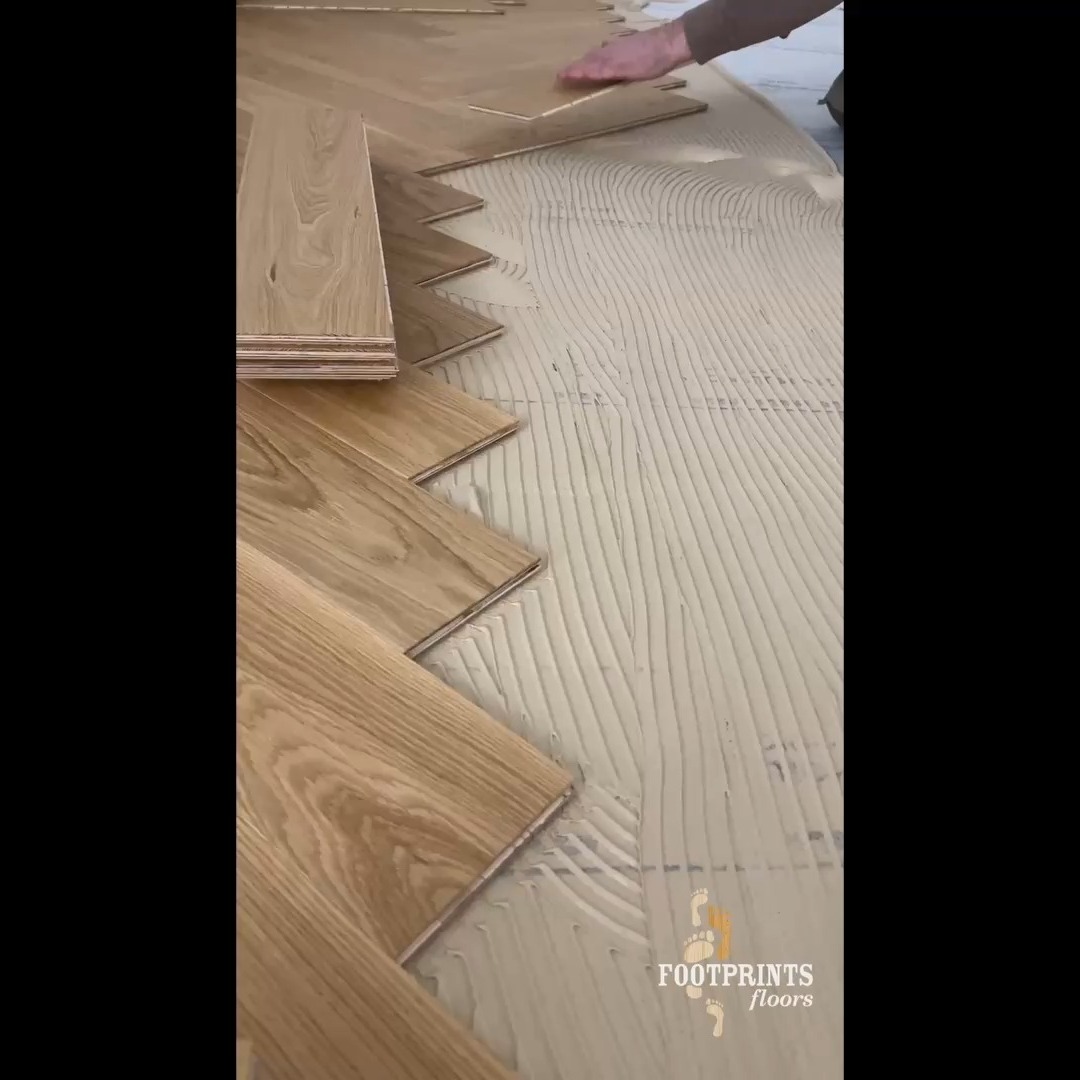 Herringbone floor install in action. reach out for a free in home estimate