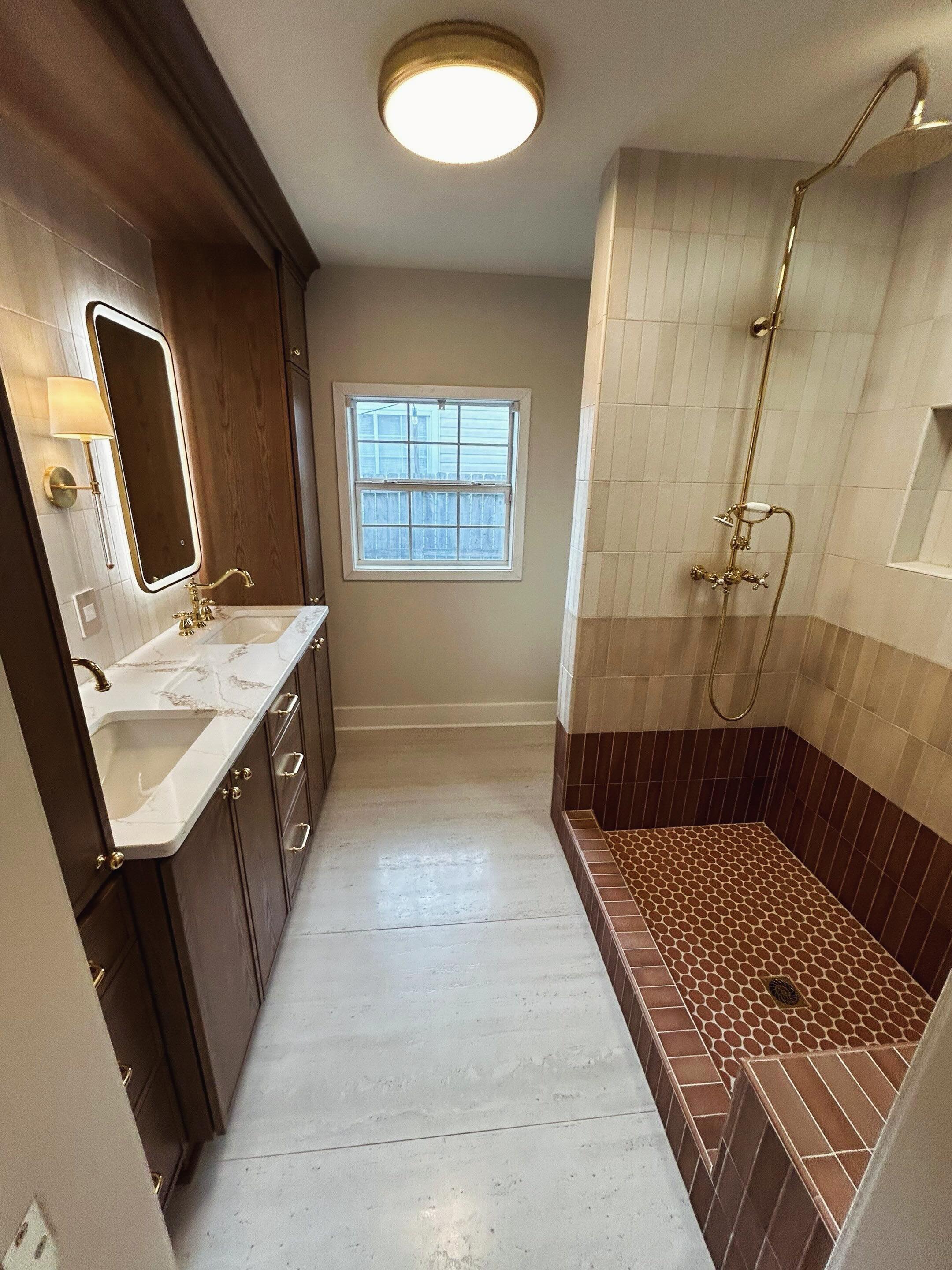 Loving this full bathroom remodel we recently completed! We installed new bathroom and closet floors, a full shower, and vanity backsplash. An old tub and small shower were demoed and the toilet moved to create a lovely large walk-in shower.  