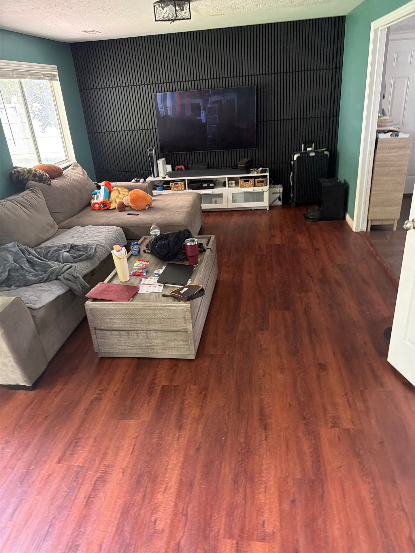 This flooring update beautifully transforms the space from a darker red tone into a brighter, modern finish that makes the room feel more open, fresh, and inviting. 🍂 Fall is the perfect time to refresh your floors and give your home a clean, updated look before the holiday season!