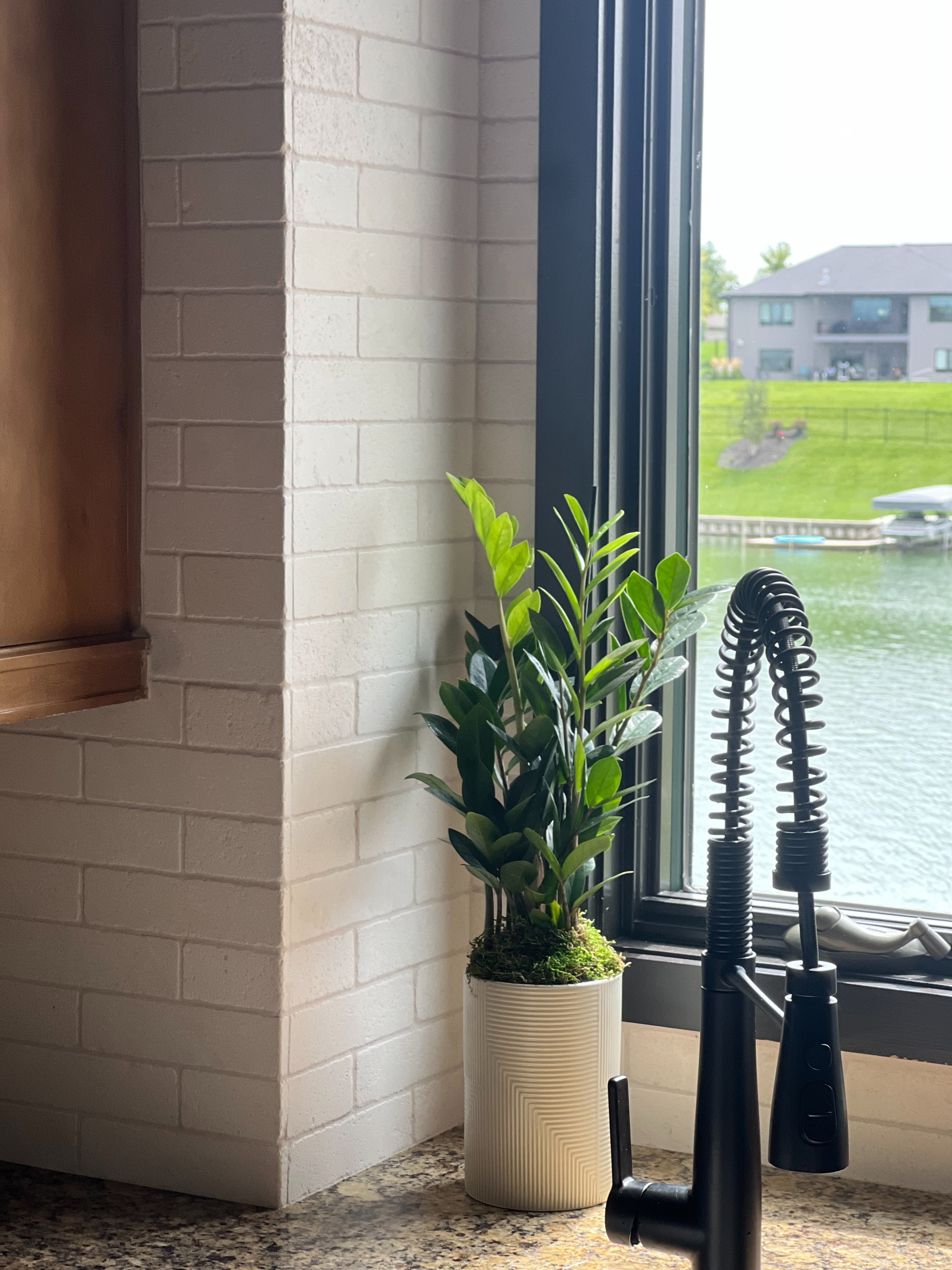 New natural stone backsplash with a view of the lake
