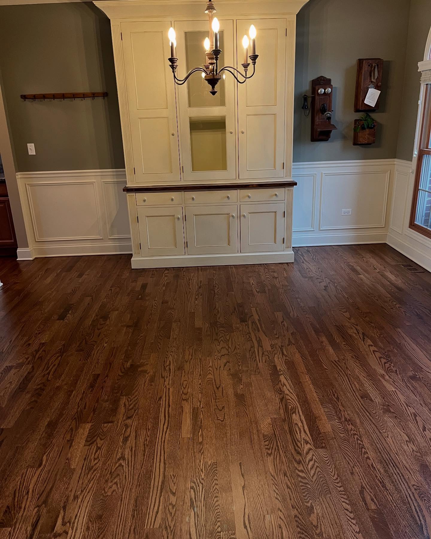 Orange you glad we gave these floors a glow-up?😉 We brought these beautiful original floors back to life by removing the outdated orange tones and refinishing them with a more timeless look.