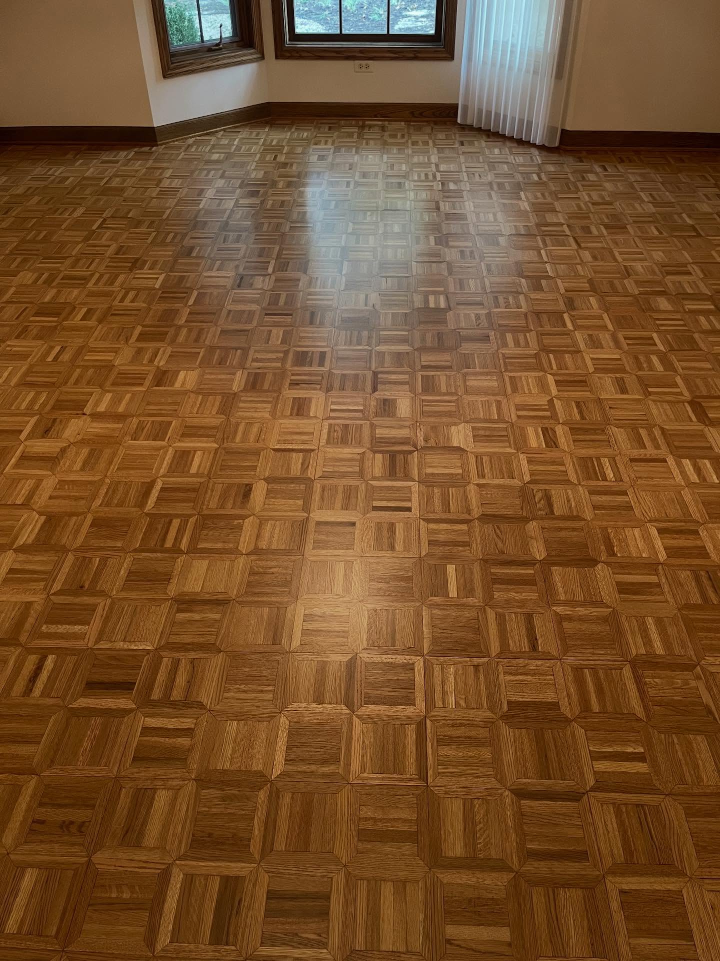 Brought this beautiful parquet floor back to life with a full refinish. Nothing like restoring classic craftsmanship to its original glow.