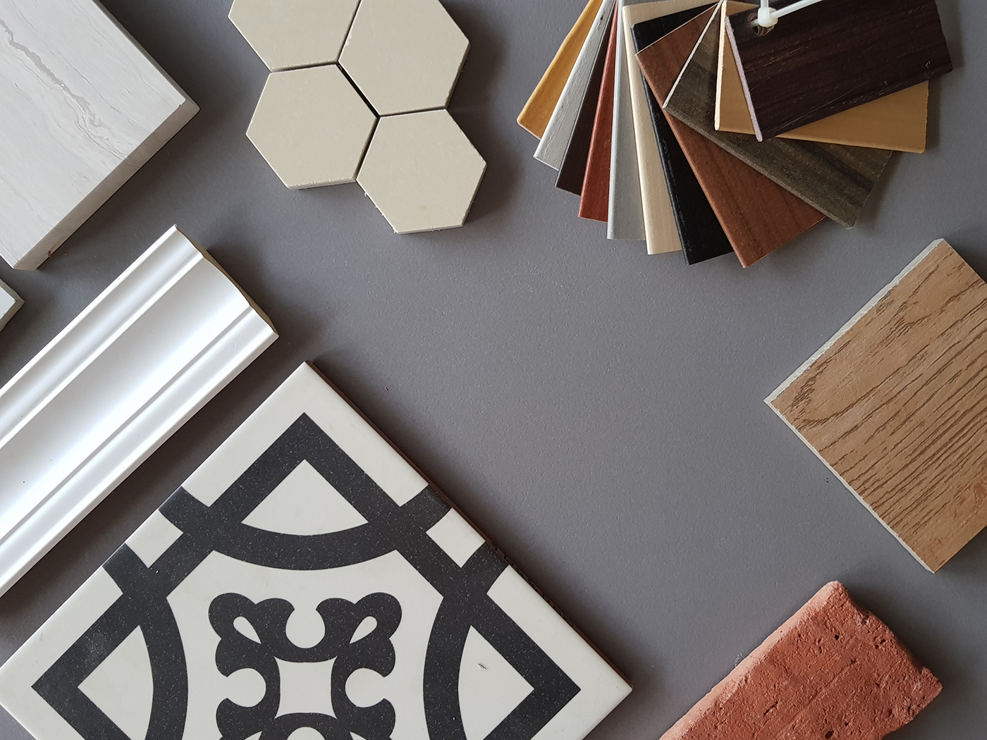 An image of different flooring and backsplash material samples - read these guides from Footprints Floors to better understand your options.