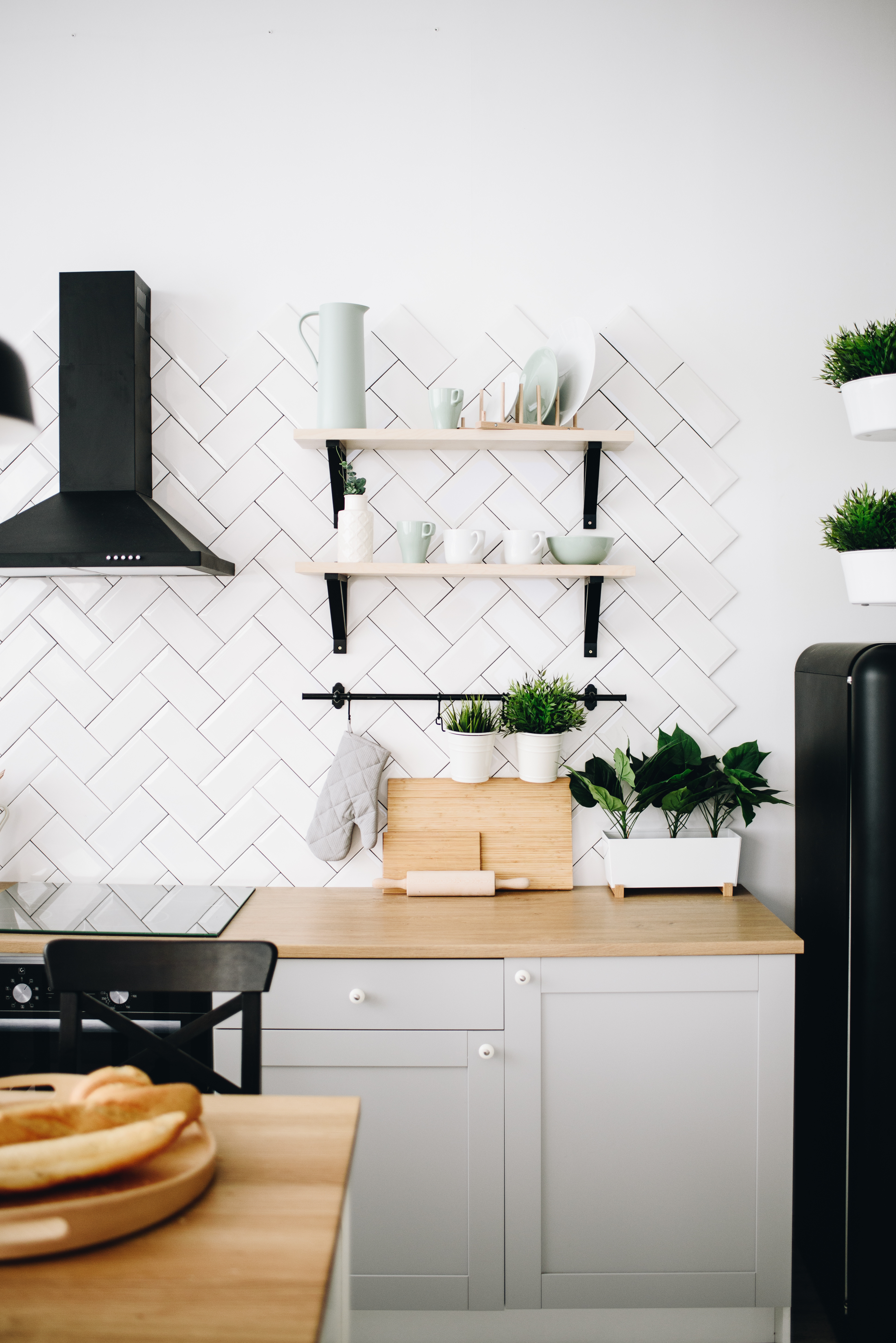 A kitchen with harringbone tile from Footprints Floors's Roseville / Folsom tile installers.