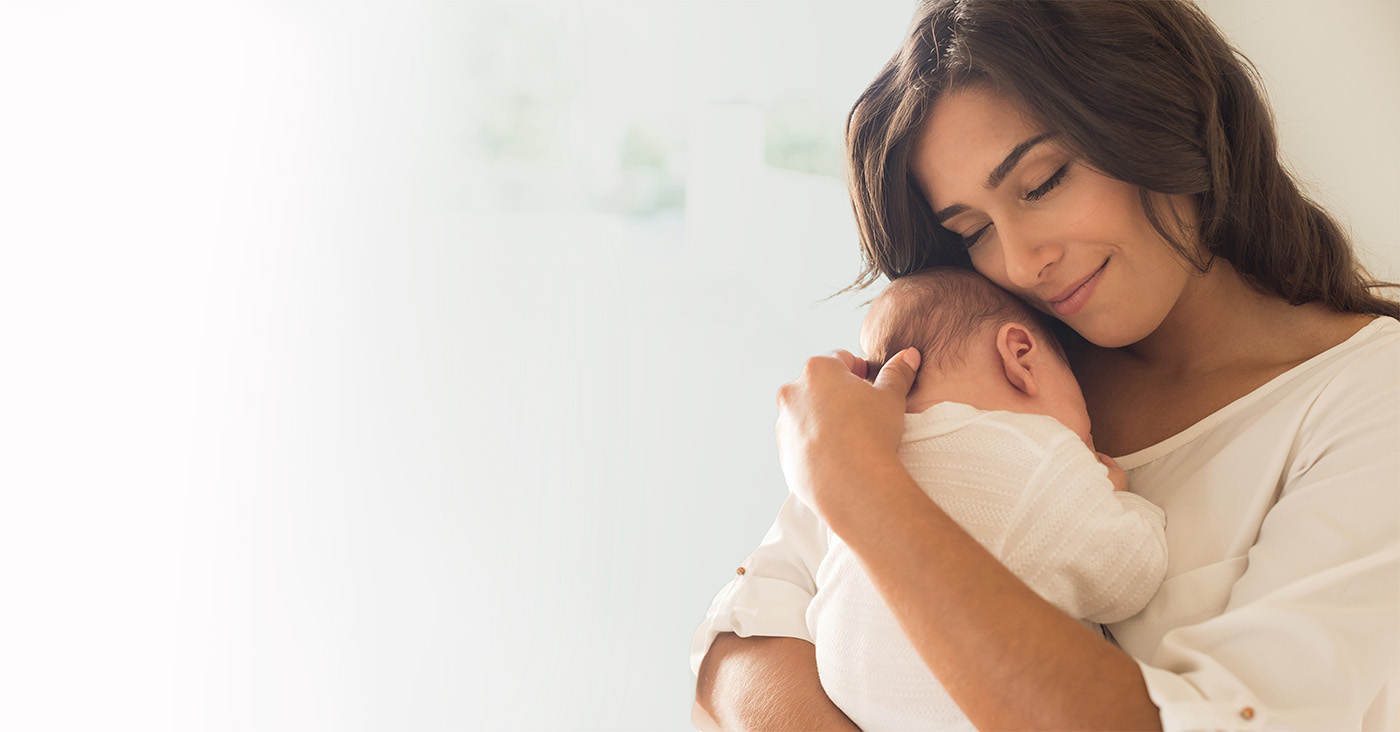 Mother and child embracing.