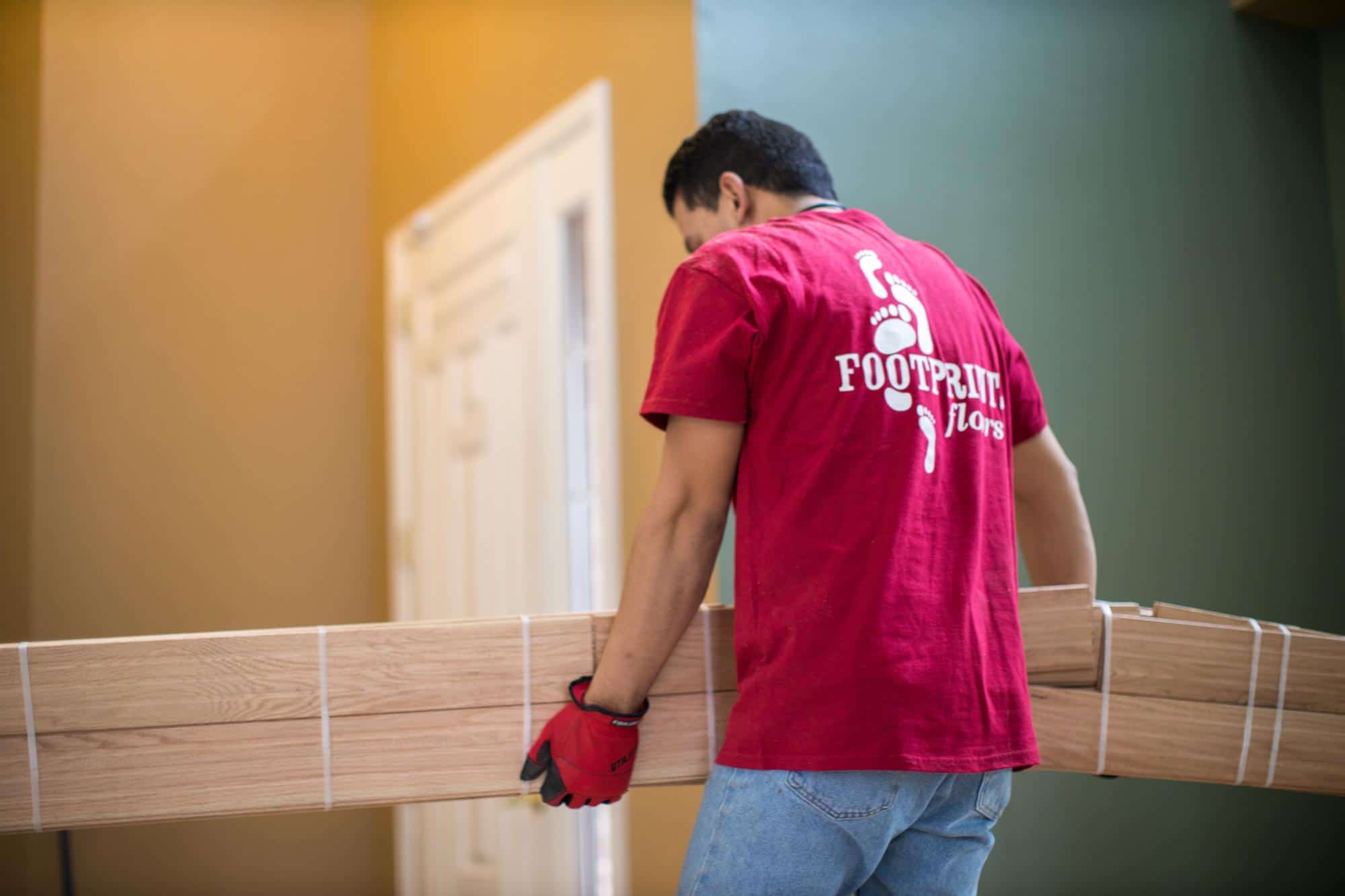 A Footprints Floors contractor working on a residential flooring project.