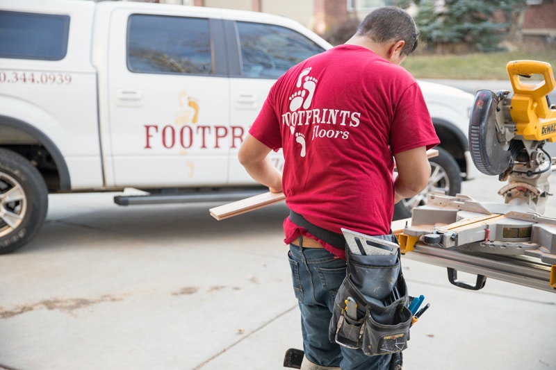 A Footprints Floors contractor working on a residential flooring project.