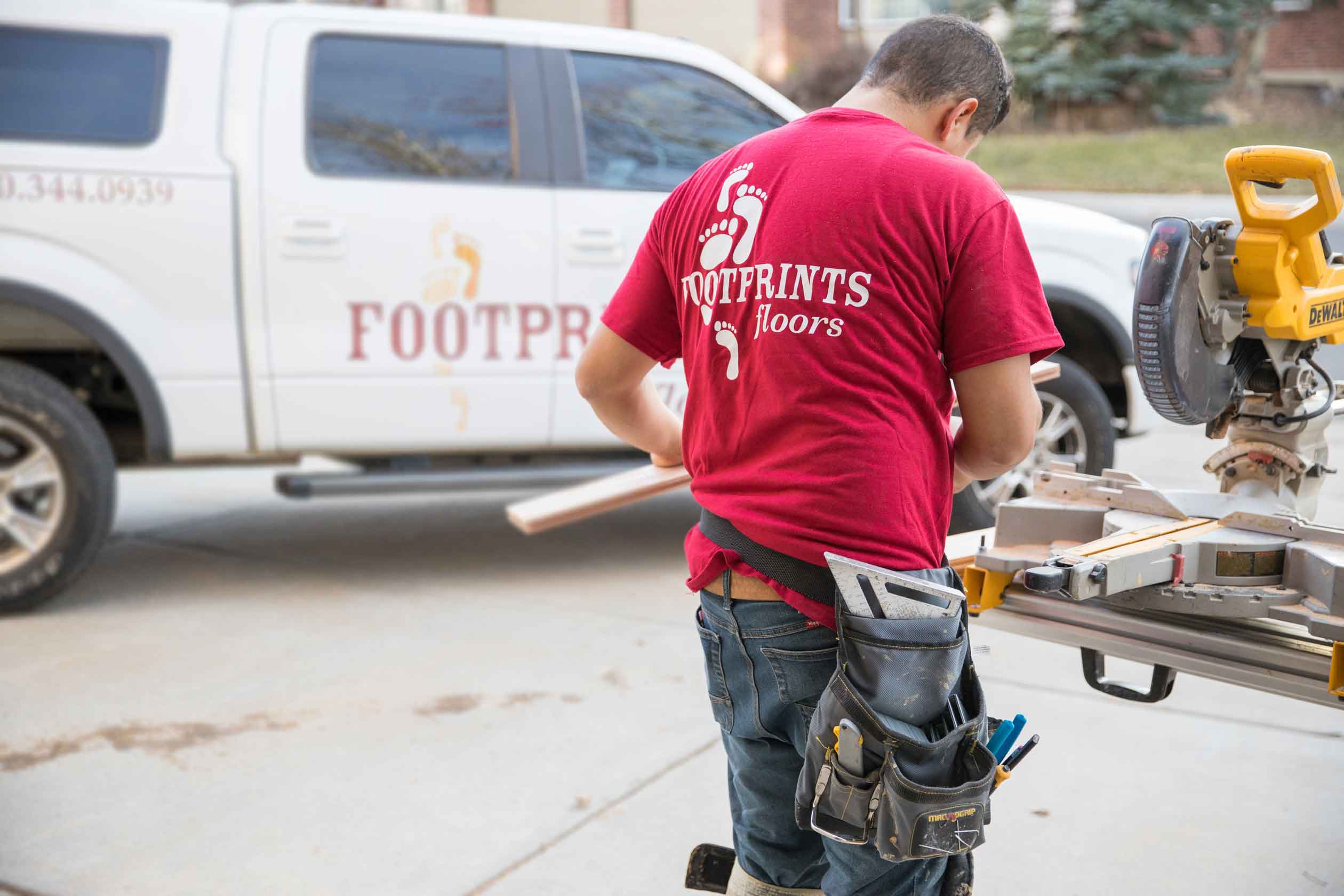 A Footprints Floors team member getting ready to install new floors in a client's home - learn more about opening a home repair franchise with Footprints Floors.