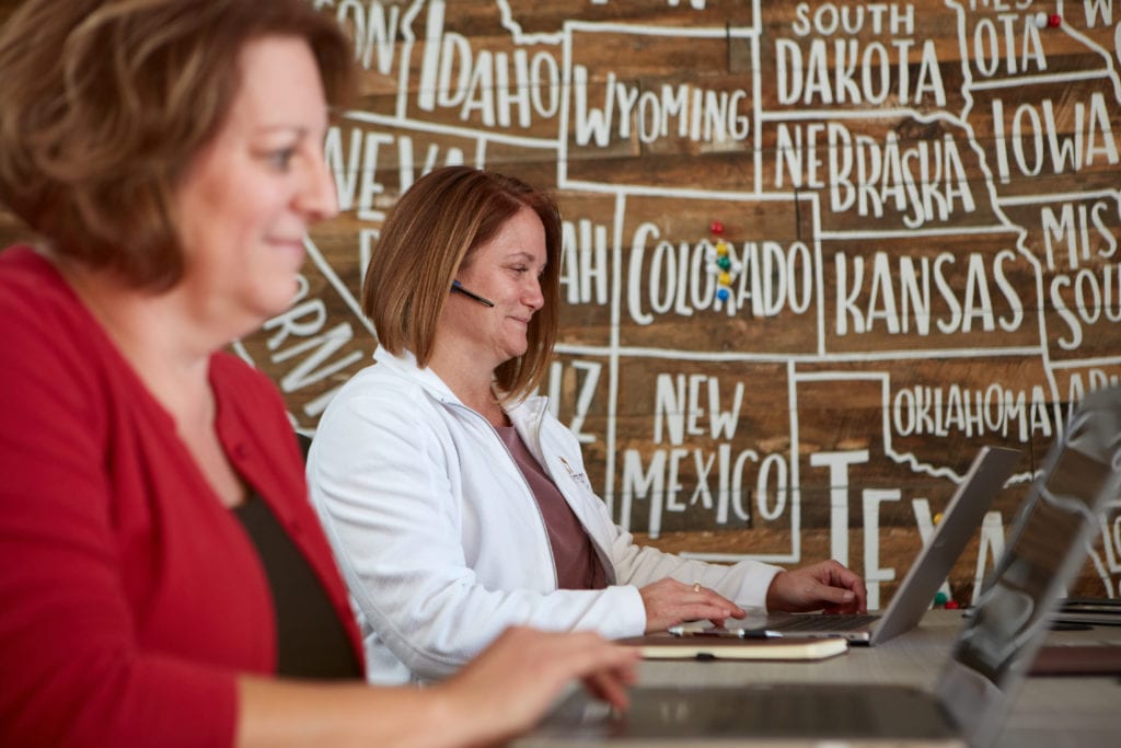 An image of two women at the Footprints Floors corporate office.