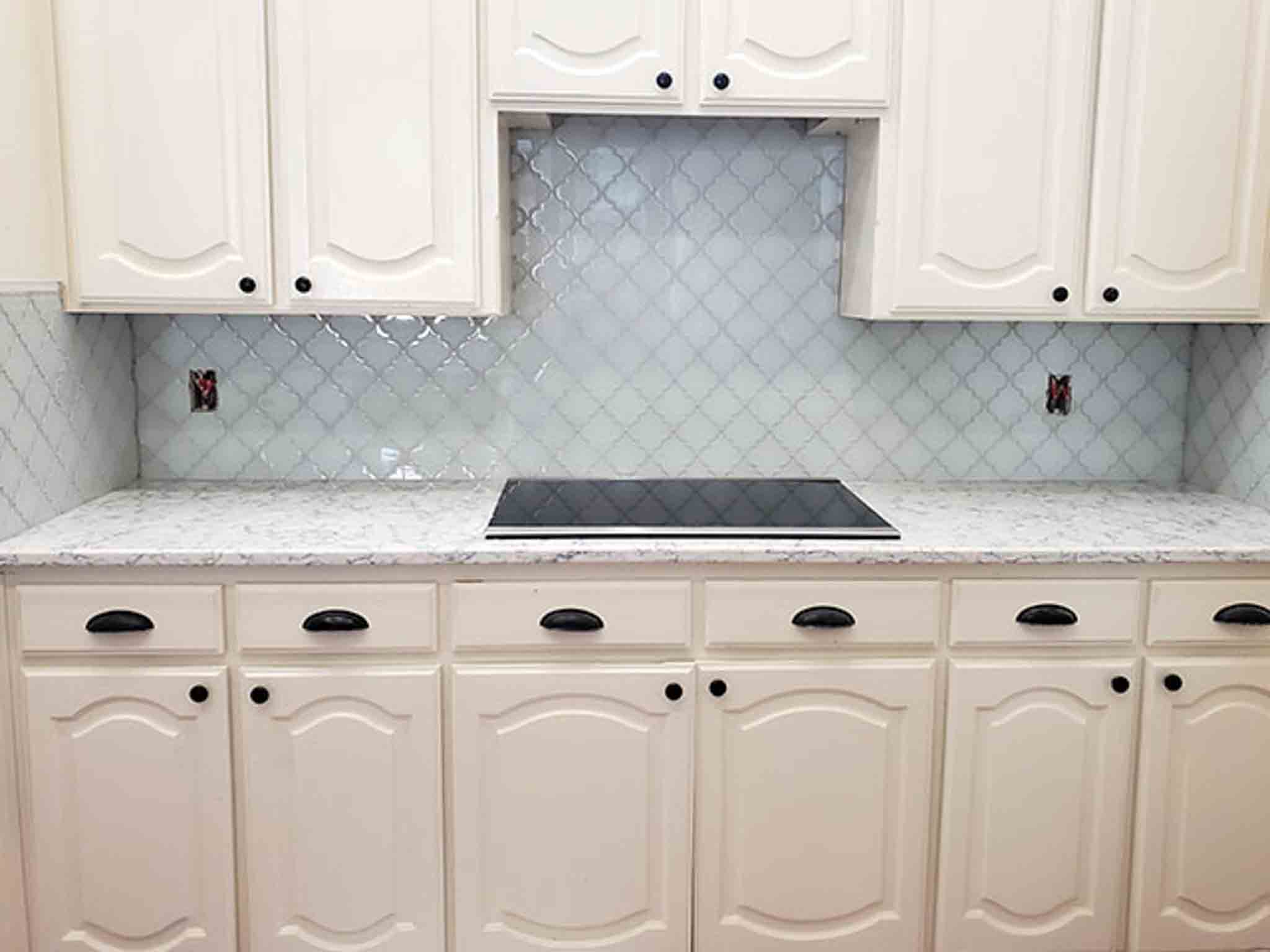 Grey tile flooring and glass backsplash installed by Footprints Floors South Sacramento.