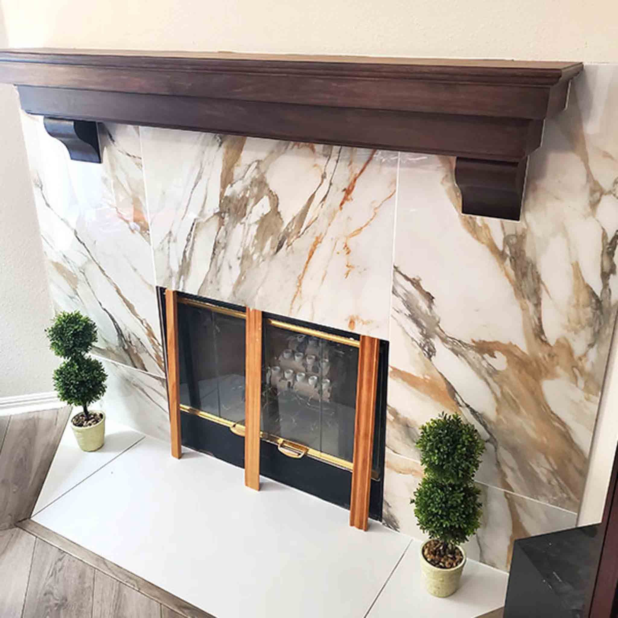 White tile installed on a fireplace.