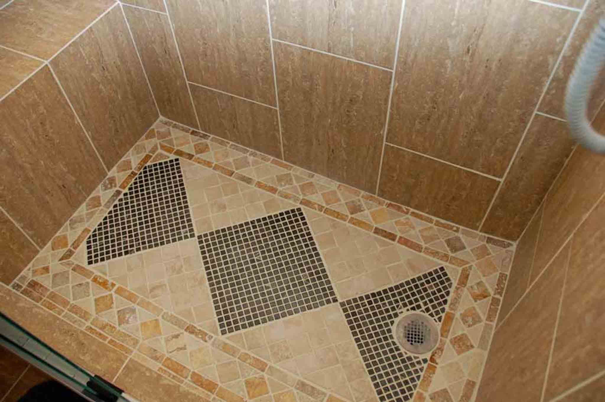 A stand up shower with brown tile, done by Footprints Floors South Sacramento.