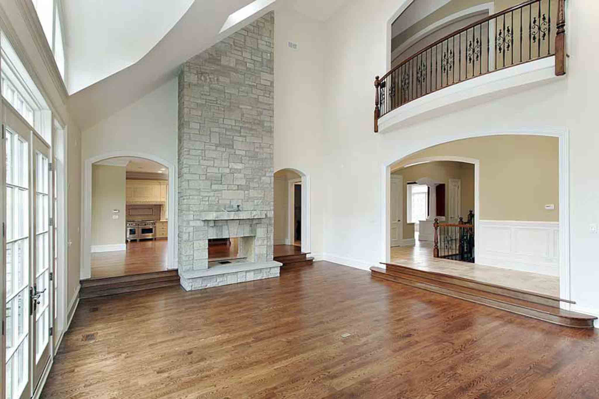 A large living room with wood flooring.