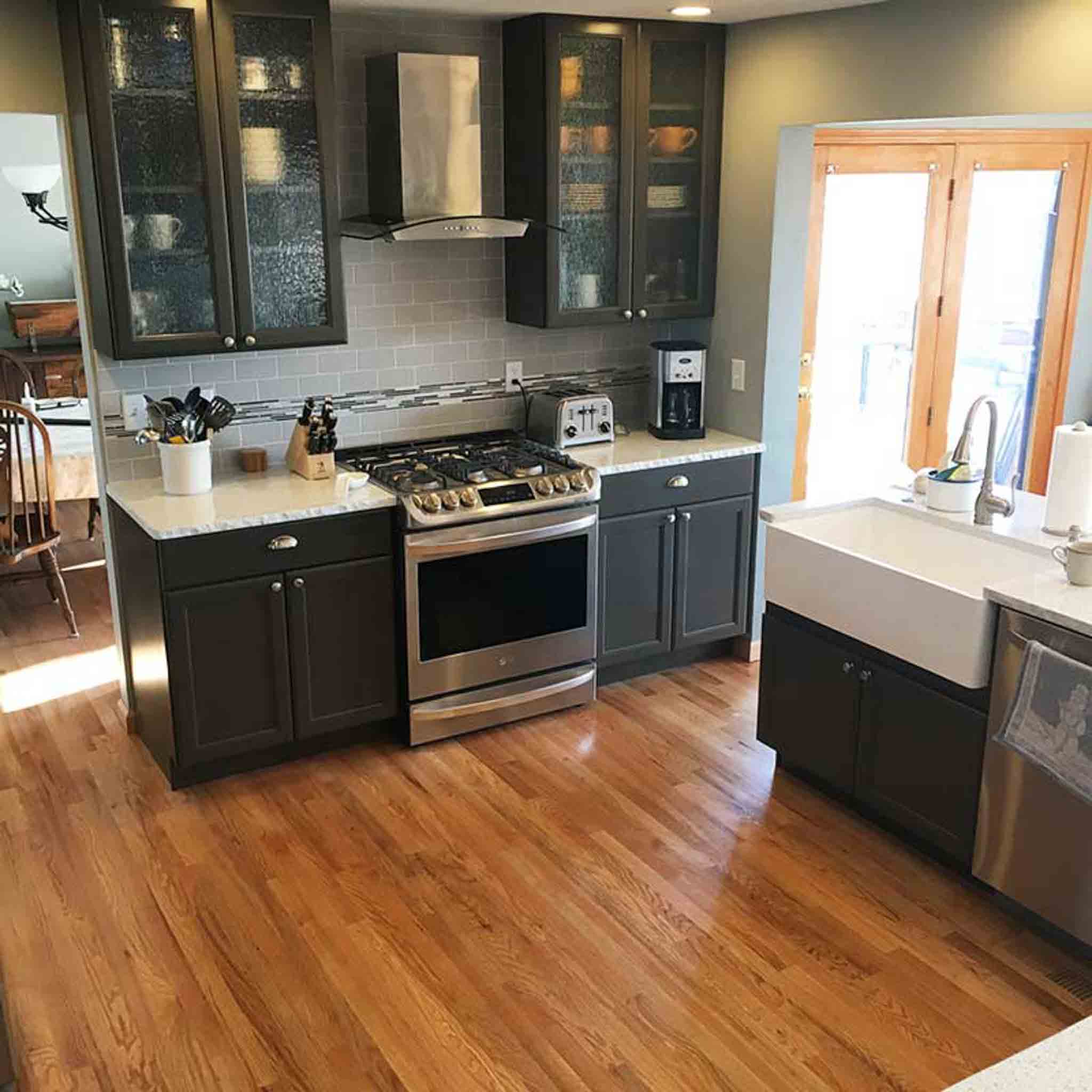 An entry hallway with wood flooring.