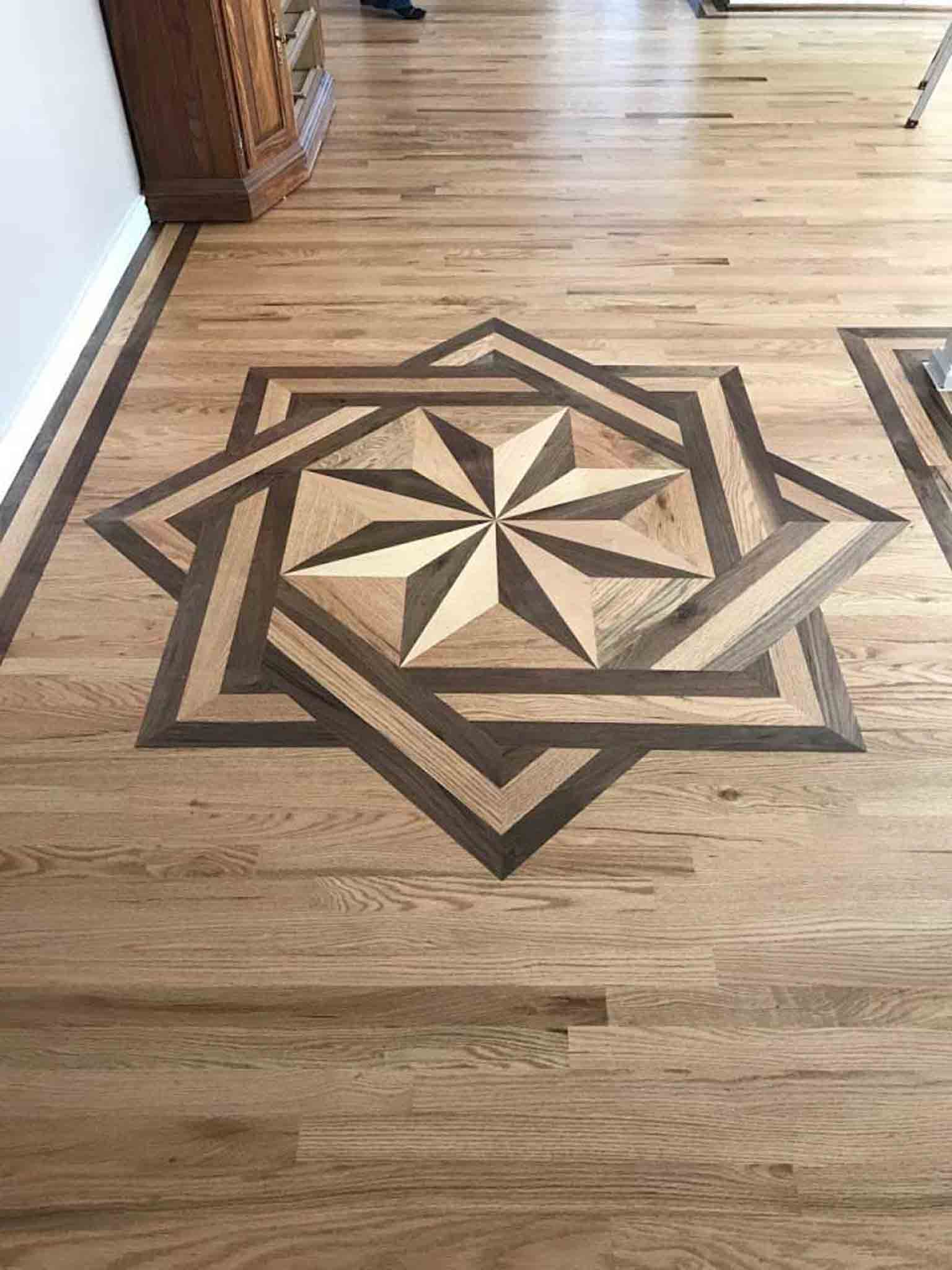 A star design in laminate flooring, installed by Footprints Floors South Sacramento.