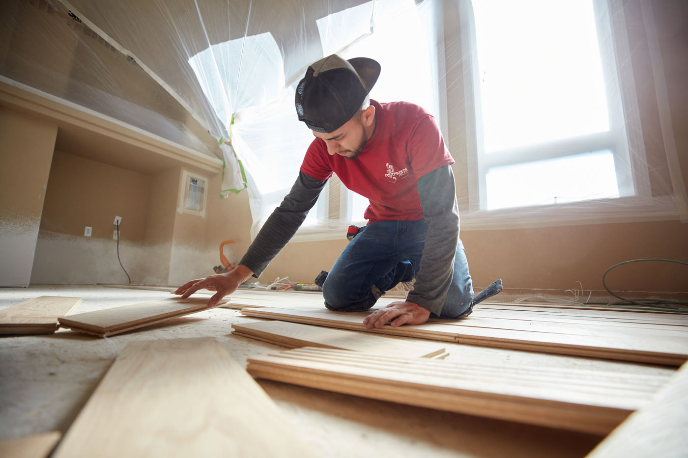 A Footprints Floors expert installing flooring - learn more about tile and hardwood floor installation from Footprints Floors in Sacramento, CA