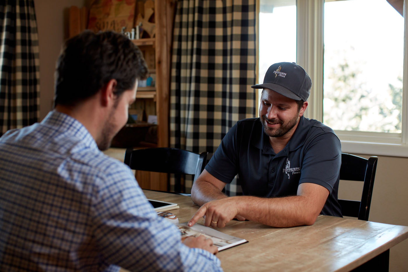 A Footprints Floors expert helping a customer decide on their flooring in Woodstock.
