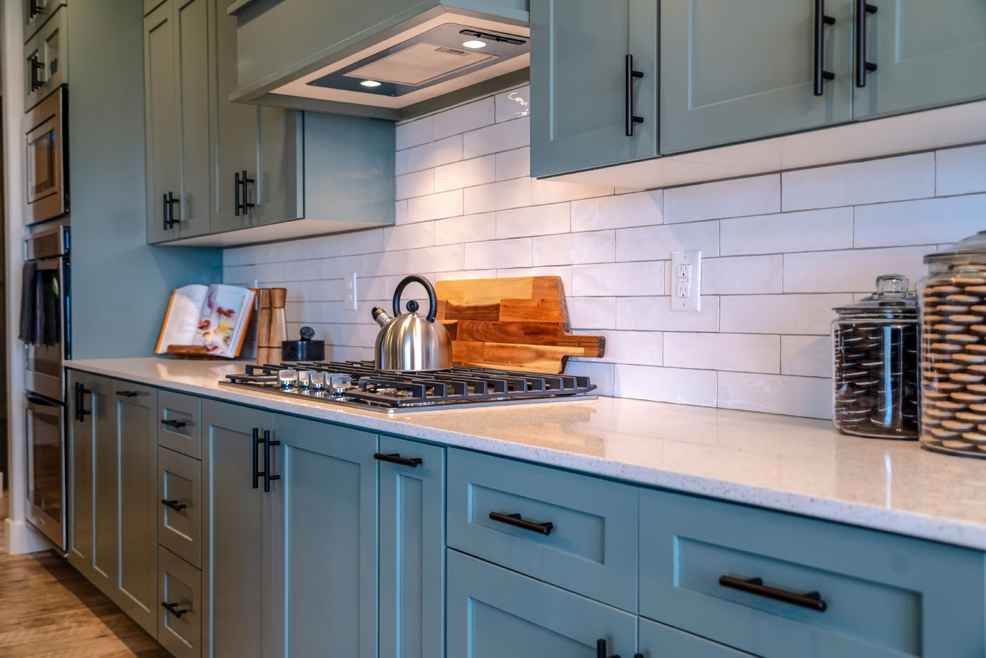 A stunning, modern kitchen with classic subway tile kitchen backsplash installation in Savannah, GA from Footprints Floors.