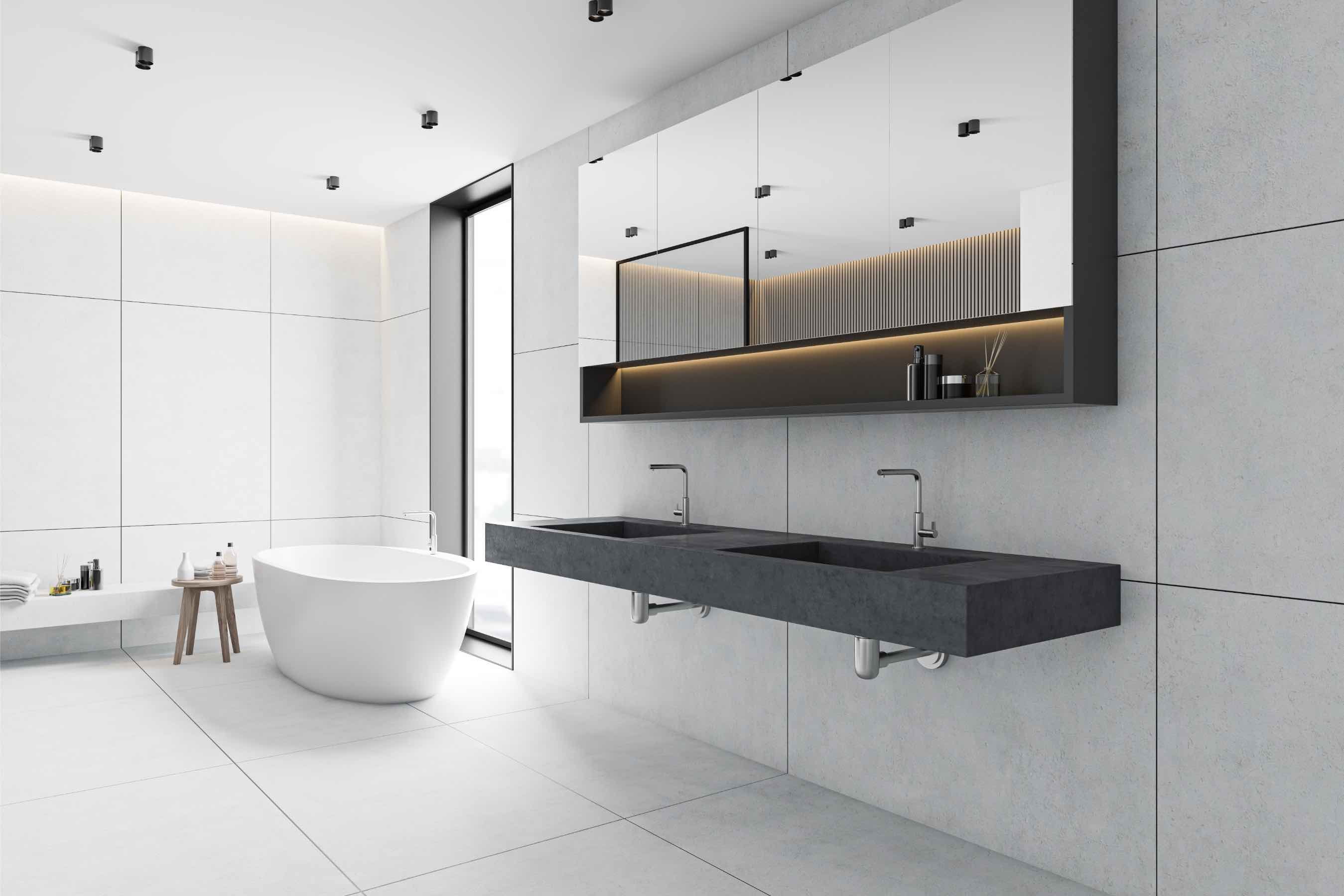 A bathroom with a stylish oversized tile backsplash design.