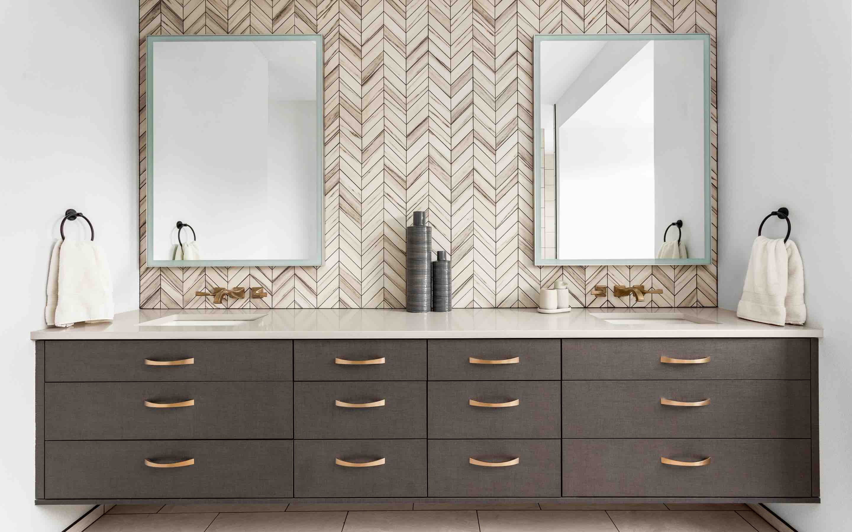 Double sink vanity with tile backsplash by Footprints Floors in Sacramento, CA