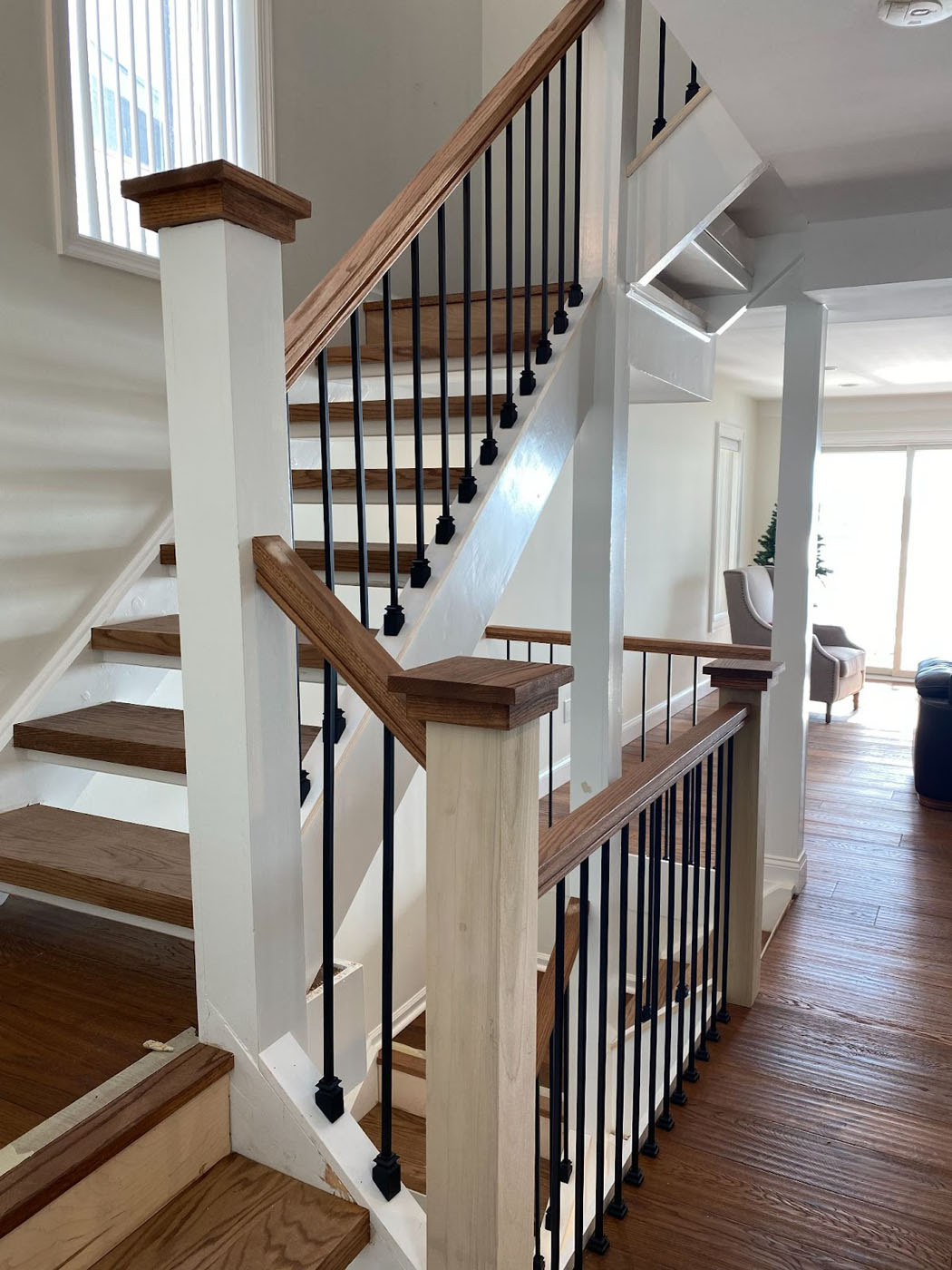 An image of beautiful hardwood floors and staircase from Footprints Floors South San José.
