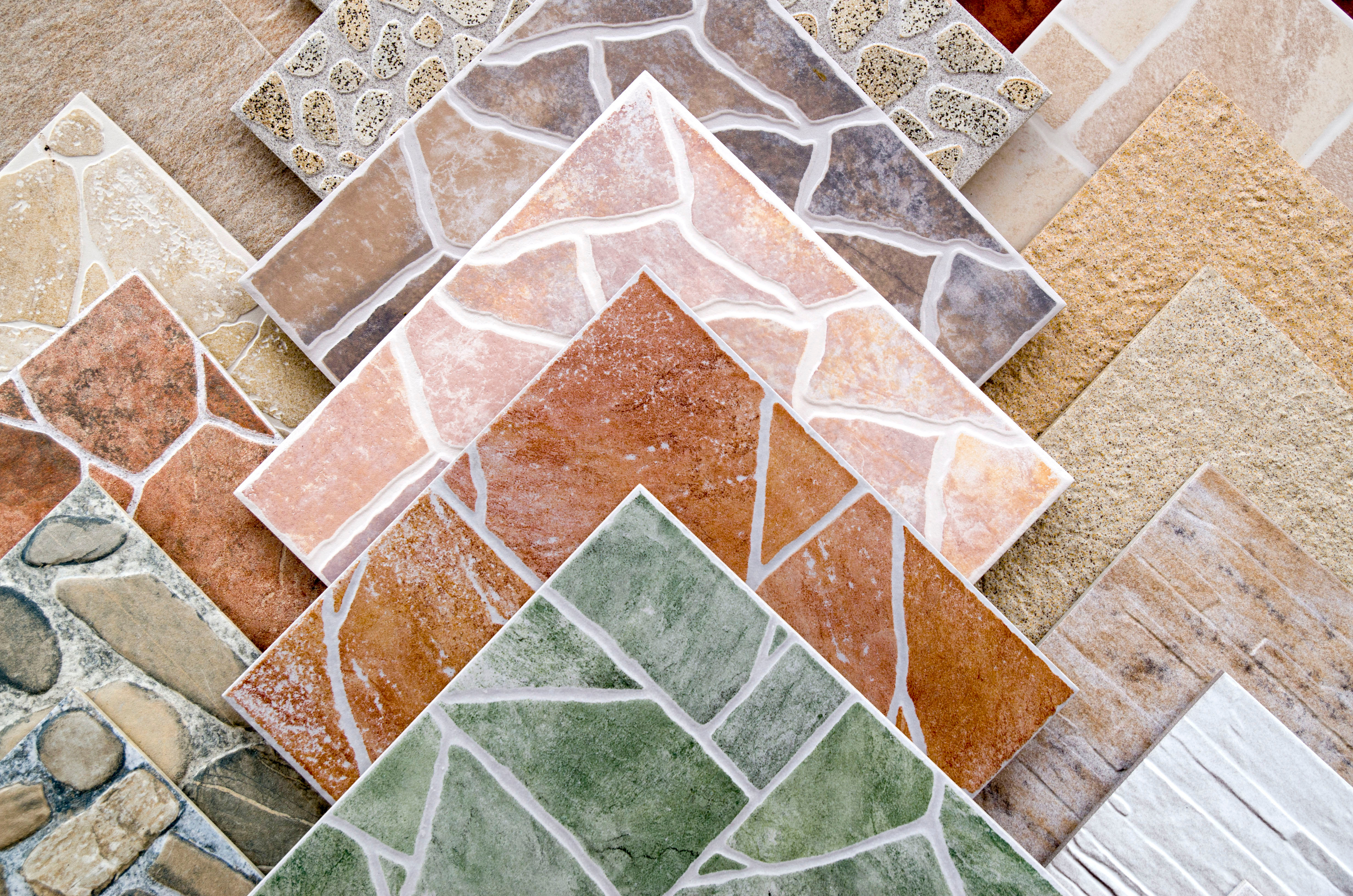 A stack of colorful ceramic tiles that will be placed by Footprints Floors.