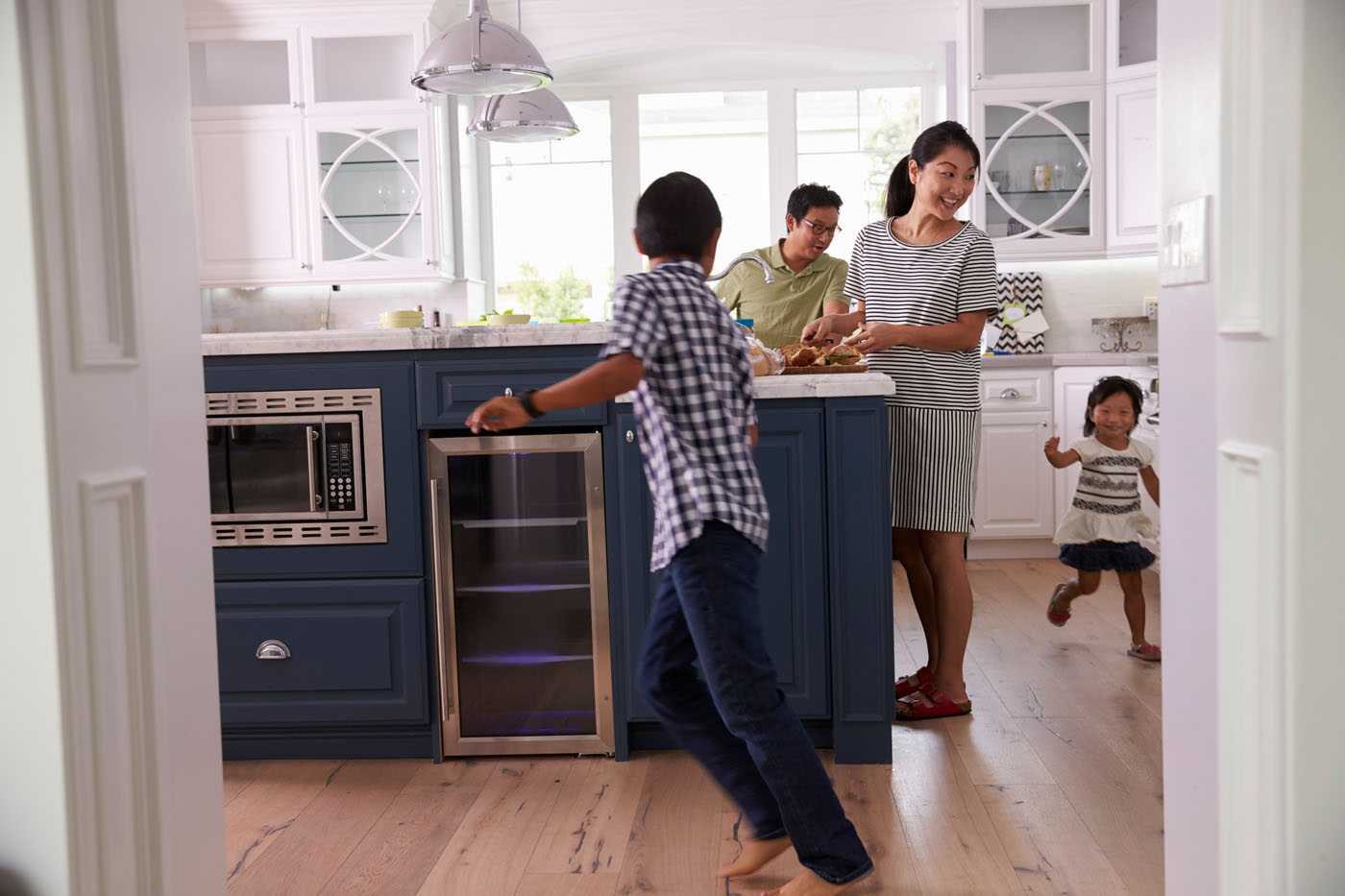 An image of a family playing together on their hardwood floors.