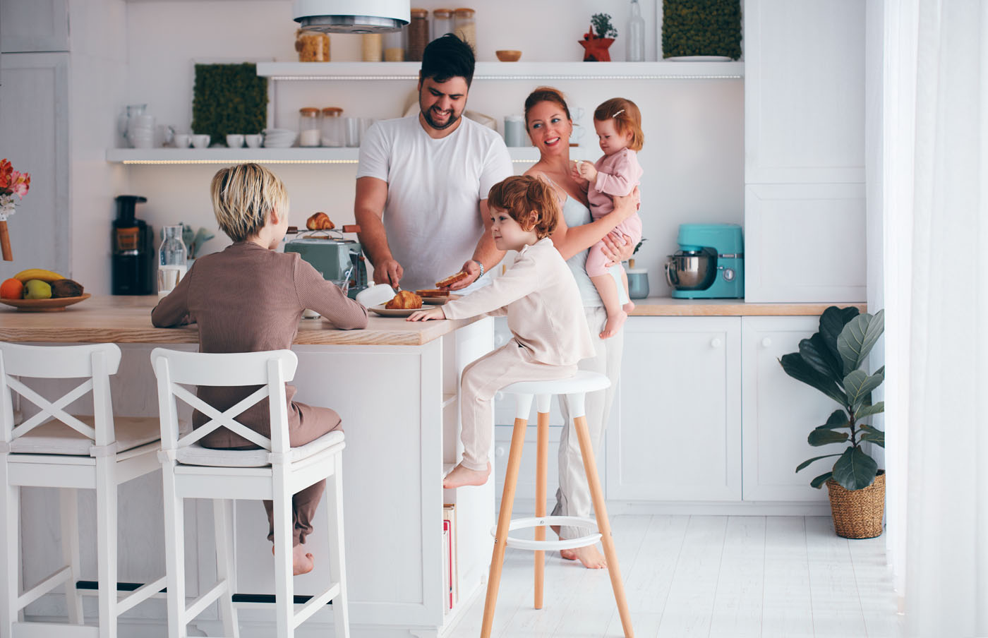 A family spending time in their kitchen which has new tile installed by Footprints Floors, one of the best tile installation companies in Sacramento, CA.