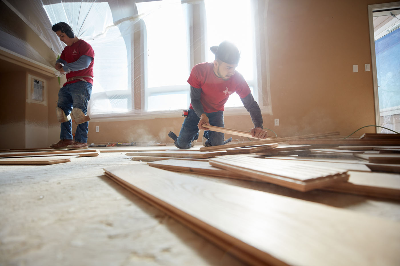 A Footprints Floors team member giving a homeowner a free estimate.