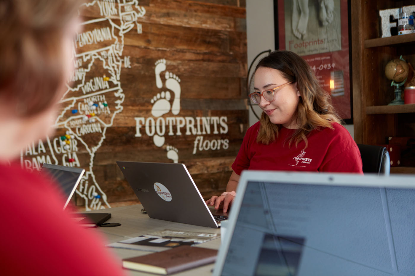 A Footprints Floors professional doing an in-home consultation for flooring services in Woodstock, GA.