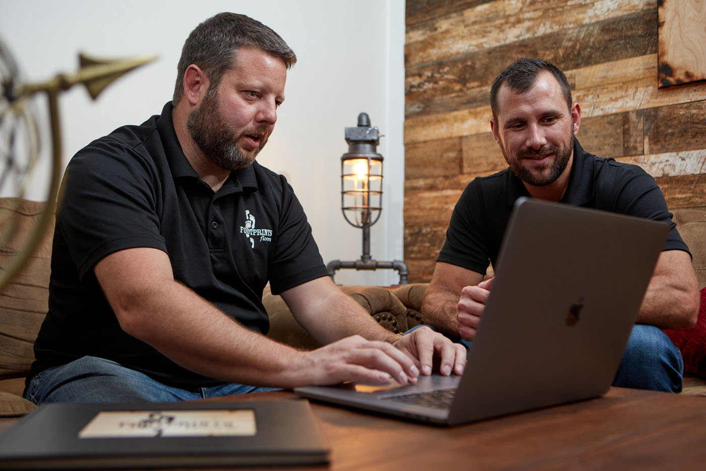 CEO and founder of Footprints Floors, Bryan Park, with another team member.