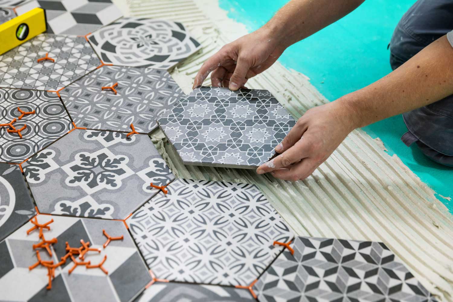 Patterned Tiles being layed by Footprints Floors.