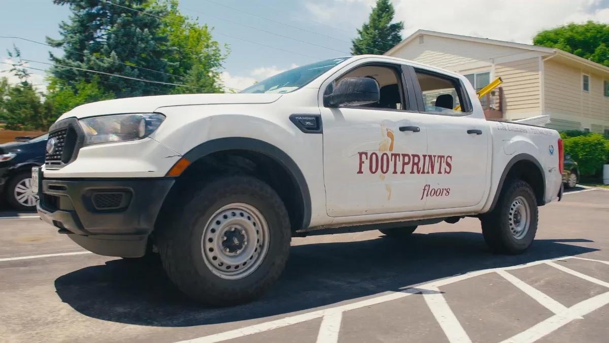 An image of a Footprints Floors truck, whose team is the best Sacramento tile installers.